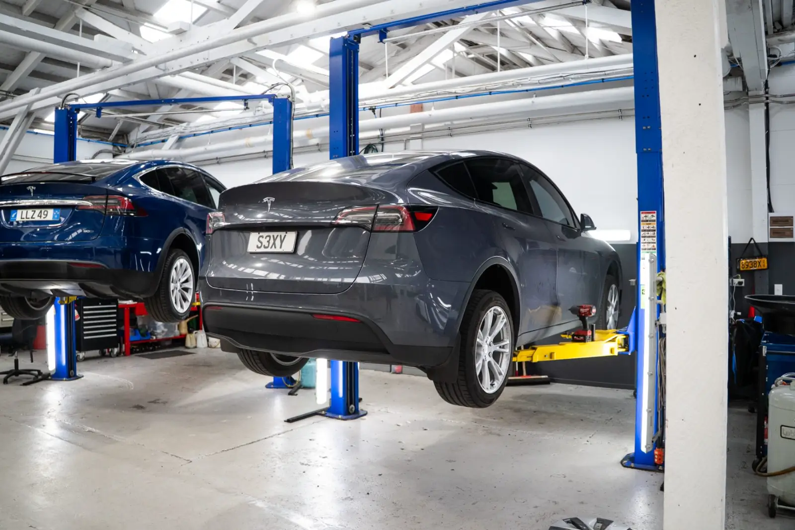 Tesla Model Y on the hoist at GVI in Auckland