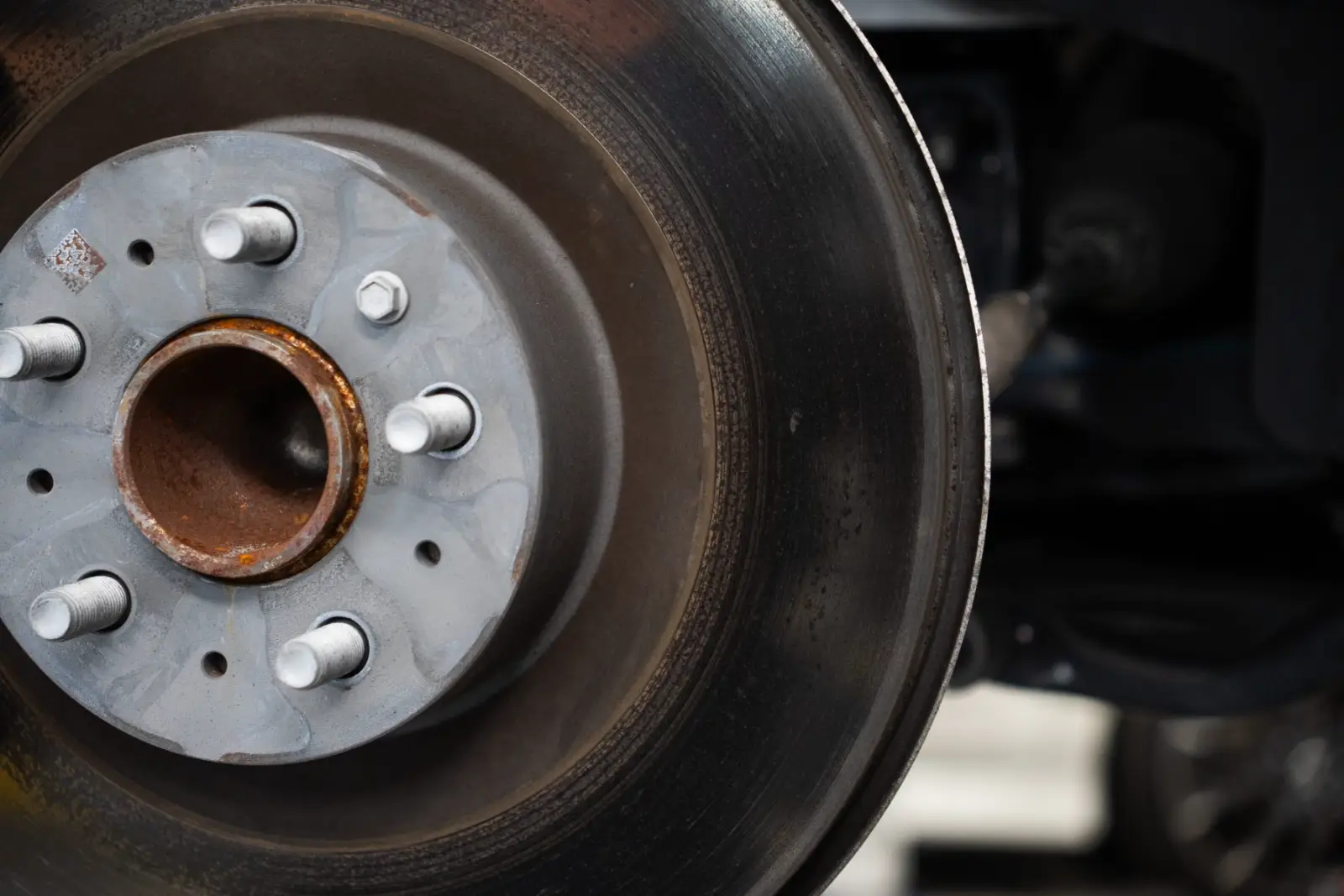 Corroded Tesla brake rotor being replaced in Auckland