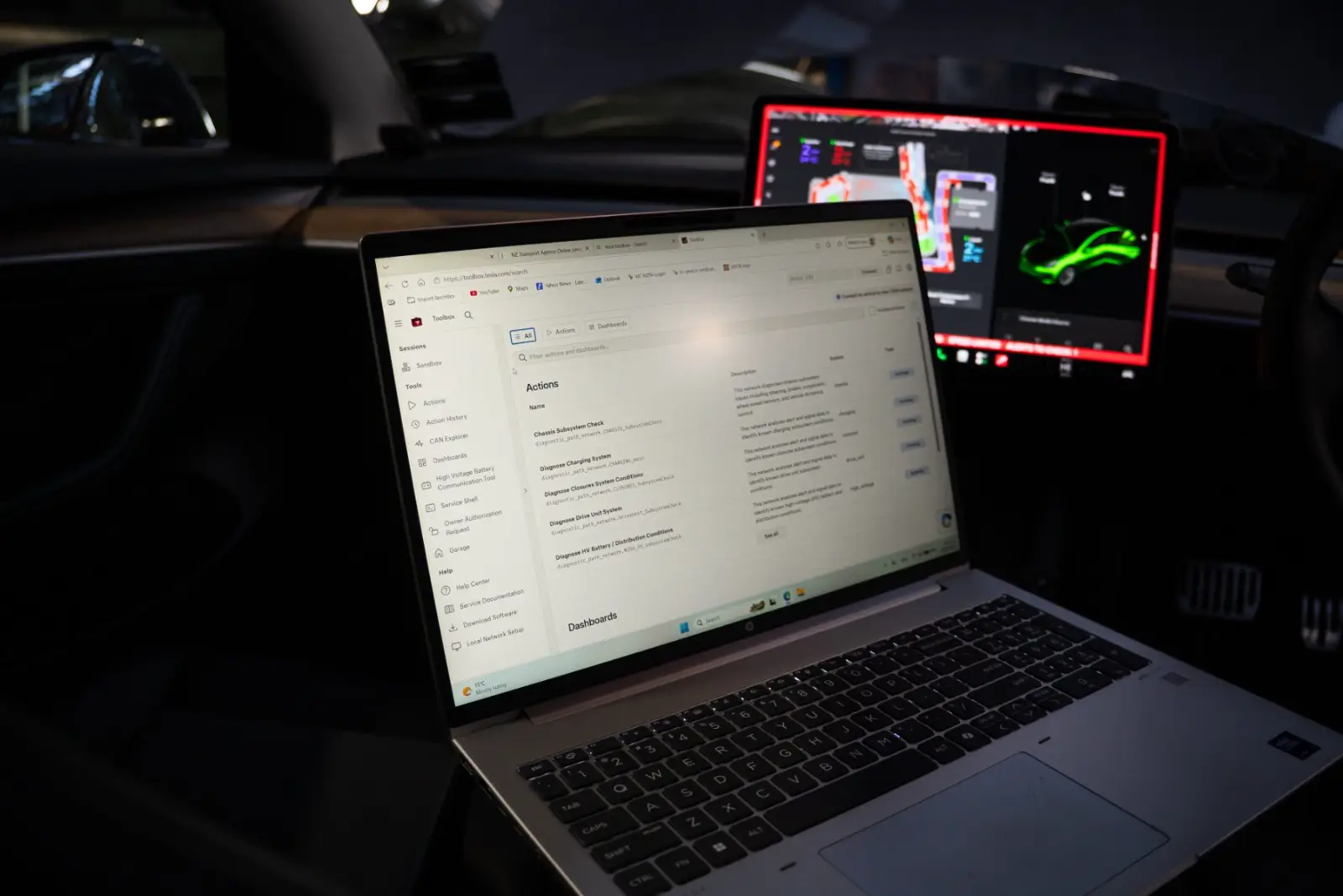 Technician running Tesla diagnostics at GVI Auckland