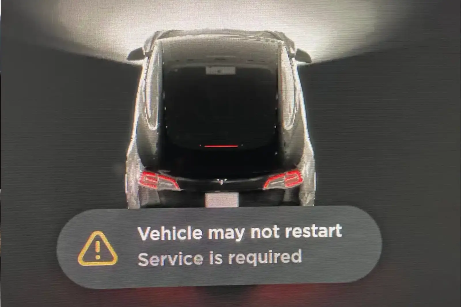 12V battery warning message on a Tesla Model 3 screen