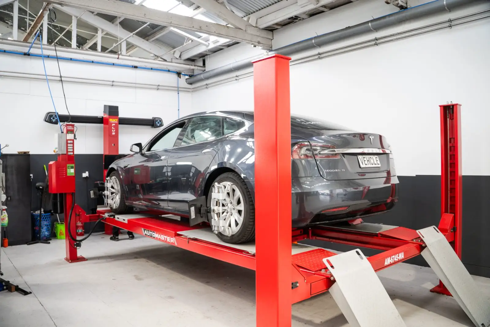 Tesla wheel alignment being measured at GVI Auckland